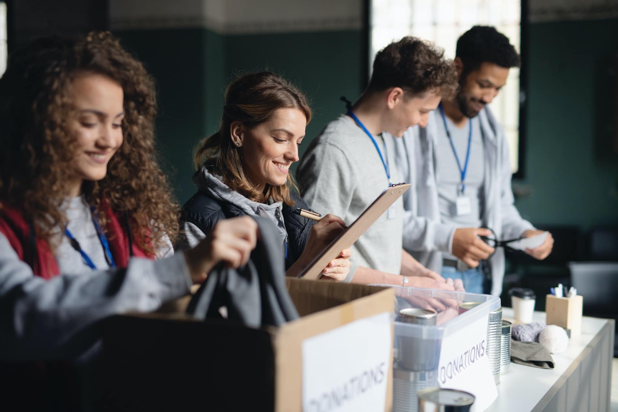Group of volunteers working in community charity donation center